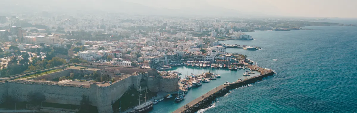 A breathtaking aerial view of Kyrenia Castle and the bustling harbor in Cyprus.