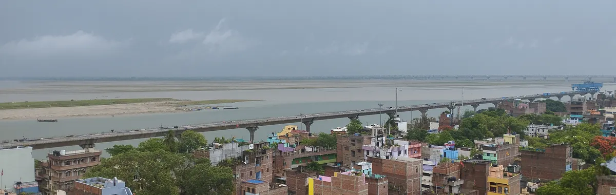 A vibrant aerial view of Gandhi Setu Bridge spanning the Ganges River in Patna, India.
