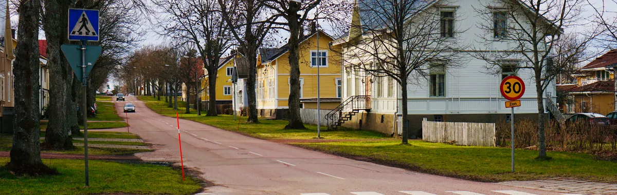 Peaceful Mariehamn neighborhood with charming houses along a quiet street.