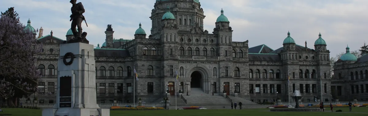 Front view of the Parliament Building and War Memorial in Victoria, BC