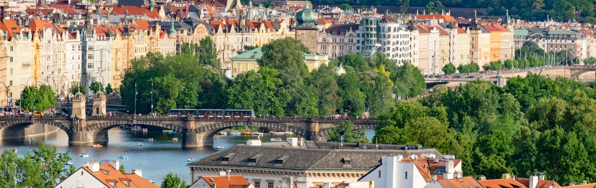 Explore the historic charm of Prague's bridges and architecture with this stunning aerial cityscape.