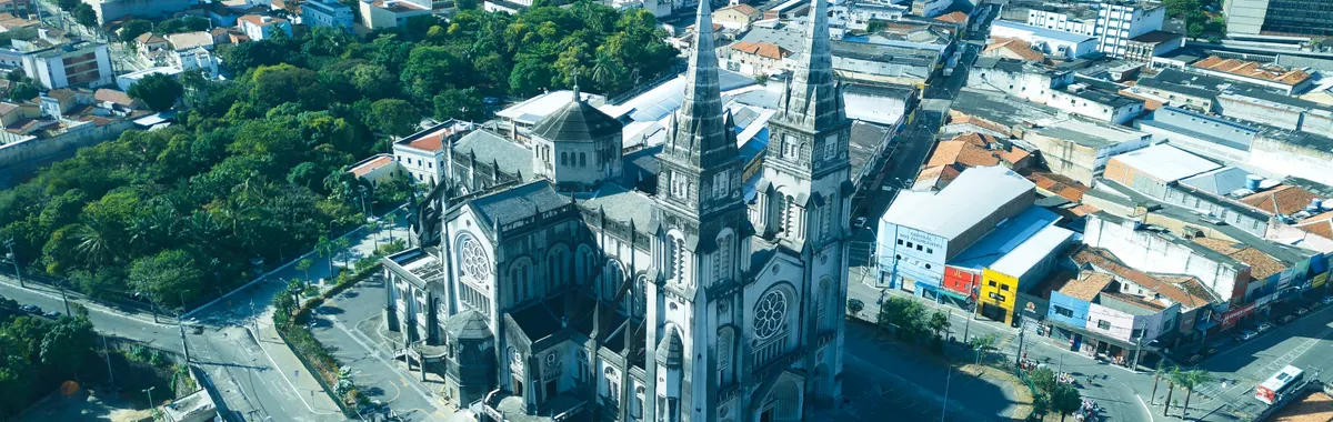 Stunning aerial view of the Metropolitan Cathedral amidst Fortaleza cityscape, Brazil.