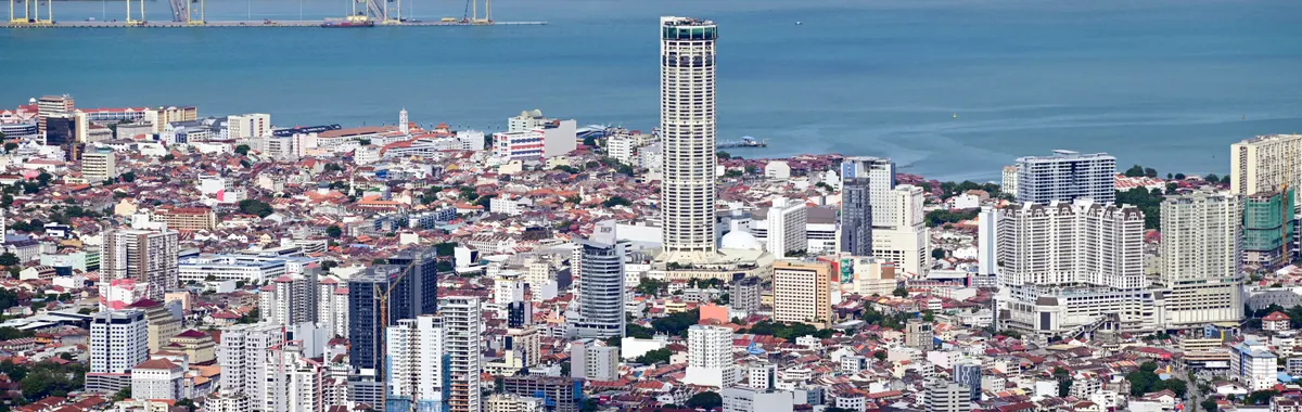 A stunning aerial view of George Town, Penang showcasing the urban landscape and coastal beauty.