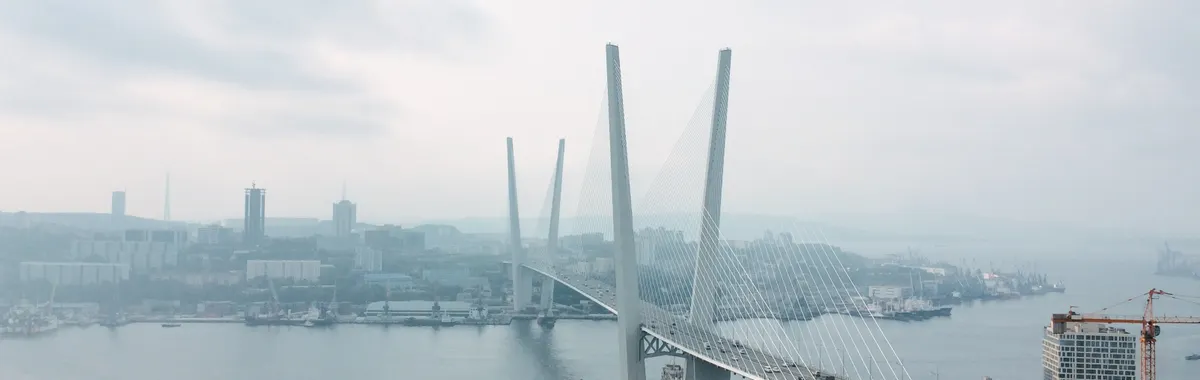 A scenic aerial view of the iconic Zolotoy Bridge in Vladivostok, Russia.