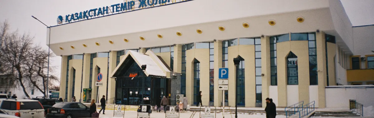 A snowy day at Aktobe Railway Station, showcasing urban winter life in Kazakhstan.