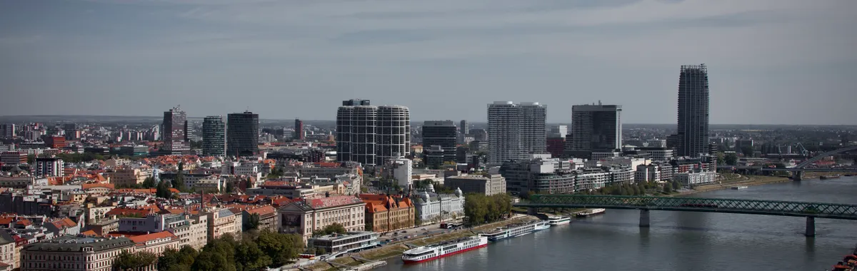 Stunning aerial view of Bratislava's skyline with modern architecture and the Danube River.