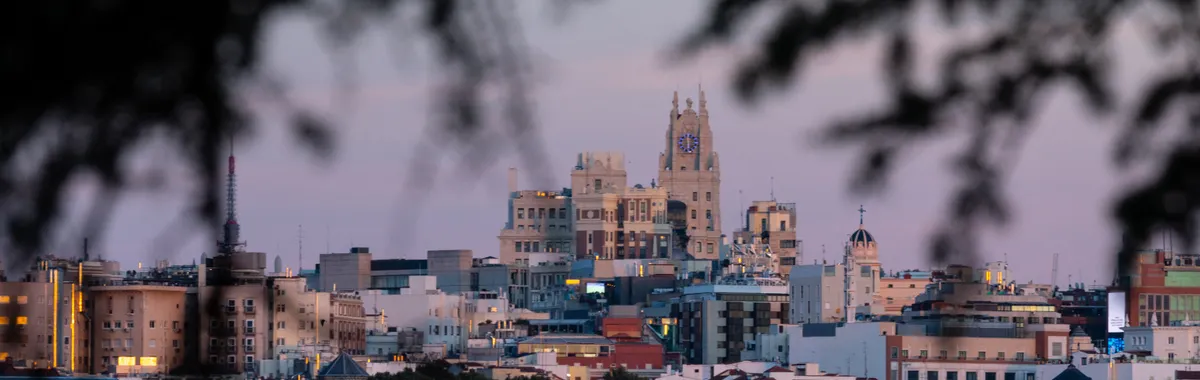 Beautiful cityscape of Madrid, Spain, captured during twilight with iconic landmarks visible.