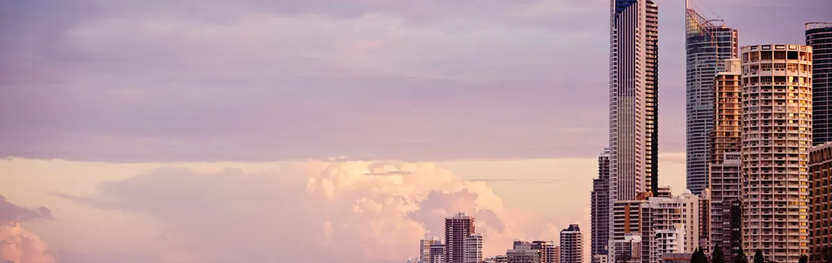 Skyline of Surfers Paradise at sunrise with skyscrapers overlooking the beach in Gold Coast, Australia.