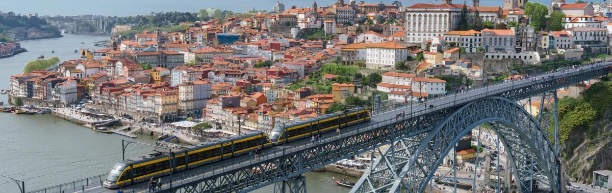 Stunning aerial shot of the iconic Luís I Bridge spanning the Douro River in Porto, Portugal.