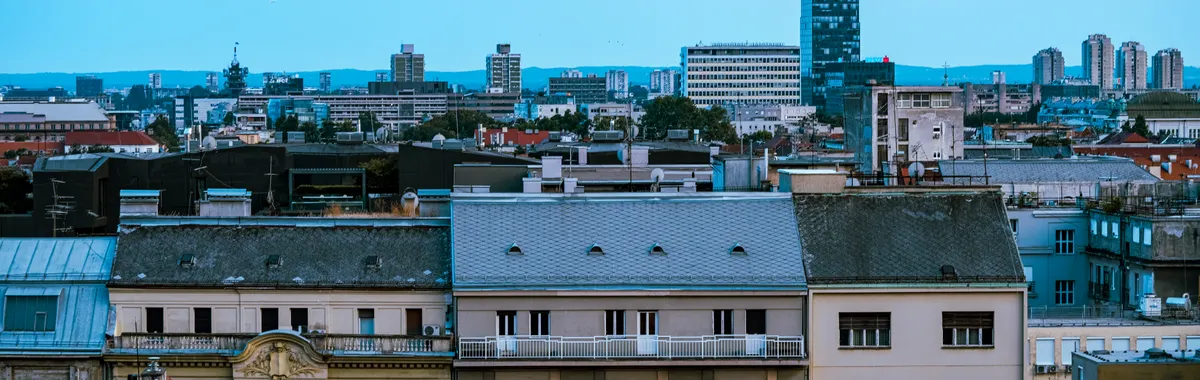 Aerial cityscape of Zagreb showcasing historic buildings and modern skyline.