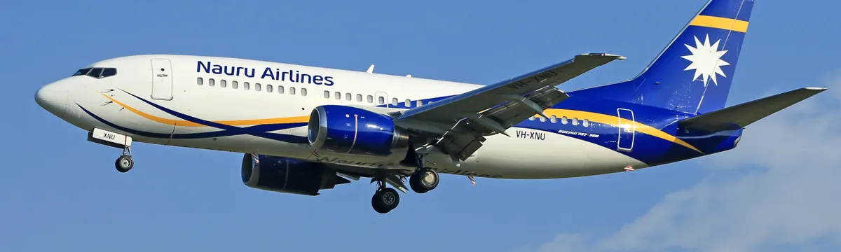 נאורו: Nauru Airlines jet flying mid-air with a clear blue sky backdrop.