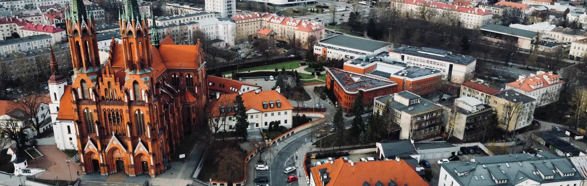 Aerial photograph of St. Roch's Basilica and surrounding cityscape in Białystok, Poland.