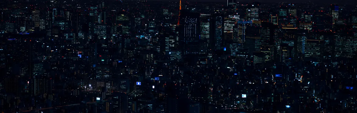 A stunning twilight view of Tokyo's vibrant cityscape featuring iconic landmarks and city lights.