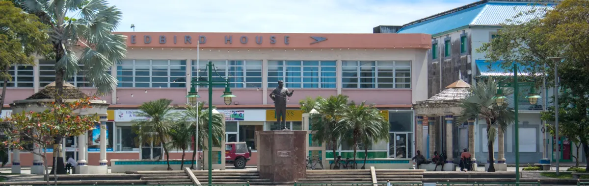 Downtown Bridgetown waterfront with iconic architecture on a sunny day.