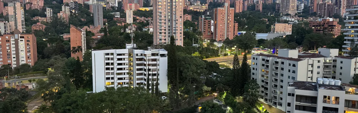 A captivating view of the Medellín skyline at sunrise, showcasing the city's urban and natural landscapes.