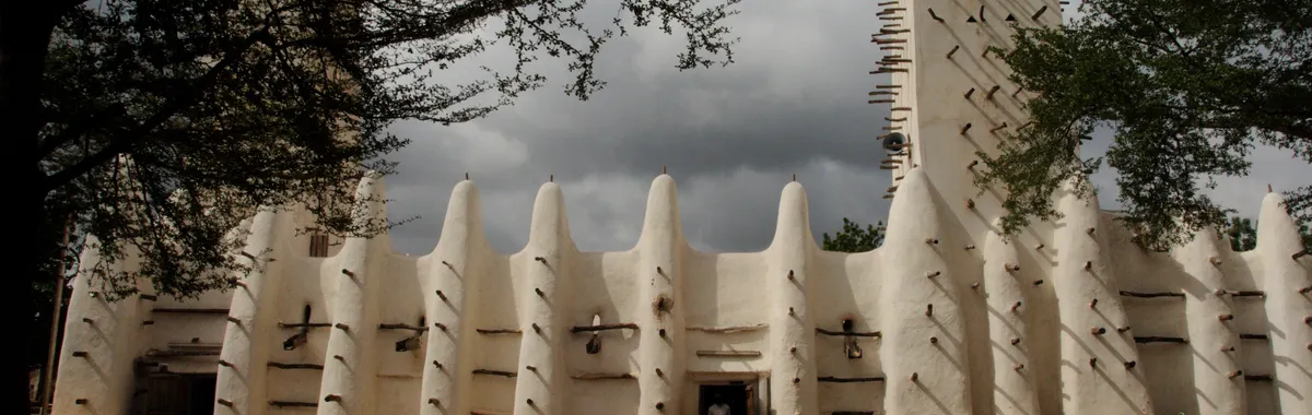 Stunning view of the Grand Mosque in Bobo-Dioulasso, Burkina Faso with dramatic sky.