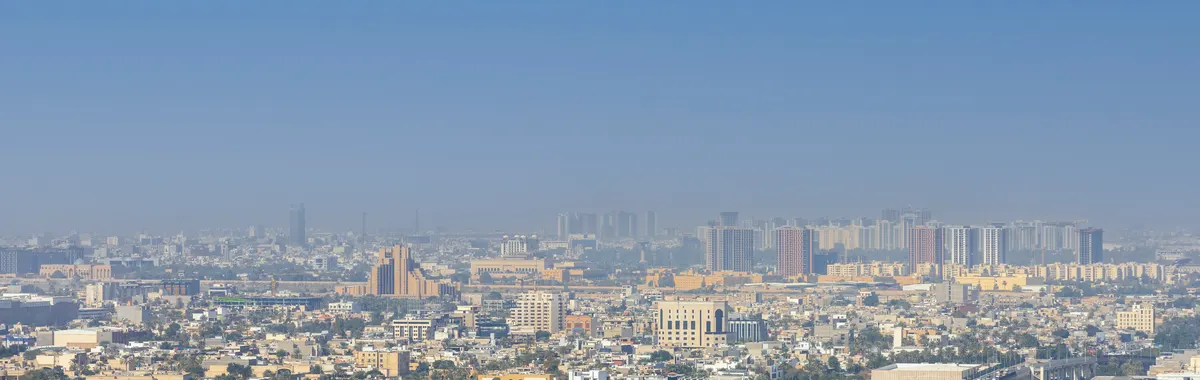 Breathtaking aerial view of Baghdad cityscape with Tigris River, showcasing urban architecture.