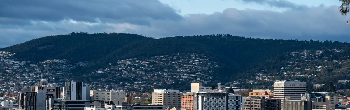 A beautiful cityscape of Hobart, Tasmania showcasing urban architecture against Mount Wellington.