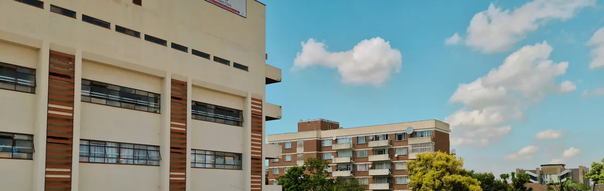 Avenues Clinic with blue sky and urban setting in Harare, Zimbabwe.
