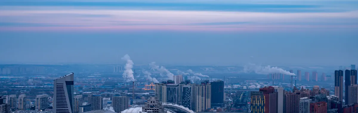 Aerial view of Harbin City, China at twilight showcasing urban skyline and architecture.