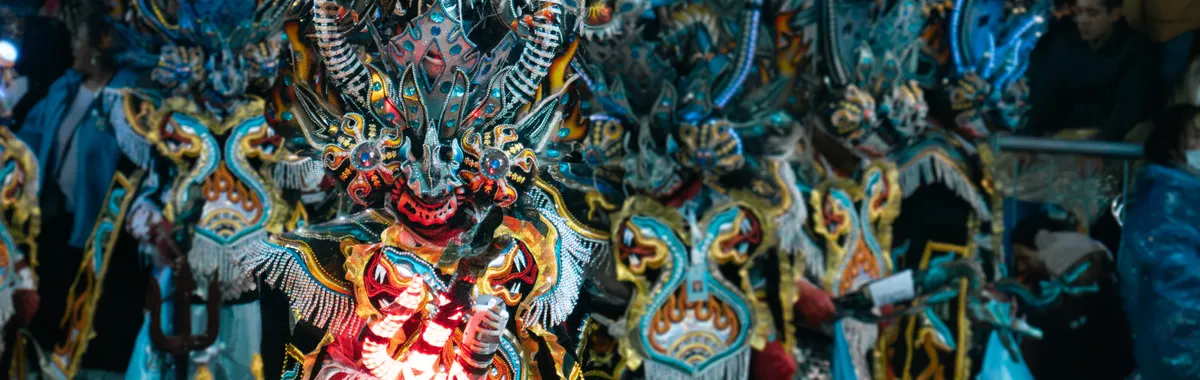 Colorful Diablada dancers in elaborate costumes celebrate at the Oruro Carnival in Bolivia.