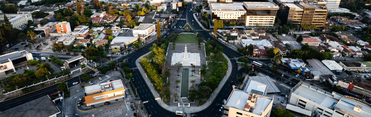 Stunning aerial shot of San Salvador's cityscape centering on the iconic Monumento al Divino Salvador del Mundo.