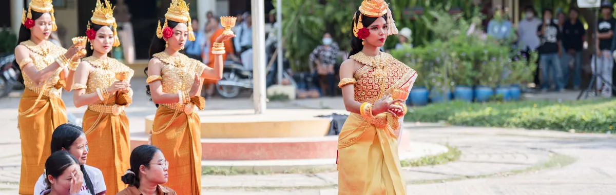 Colorful traditional Cambodian dance ceremony performed outdoors in Battambang Province.