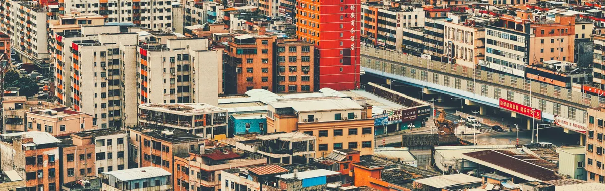 Aerial view of the densely packed buildings in Dongguan, China showcasing the urban density and architecture.