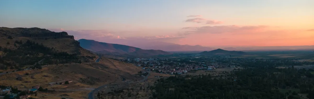 Breathtaking aerial view of Develi, Kayseri, Türkiye at sunset, highlighting picturesque landscapes.