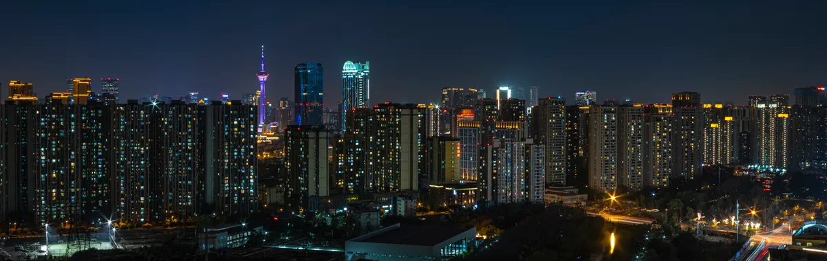 Explore the vibrant Chengdu skyline at night showcasing urban architecture and city lights.