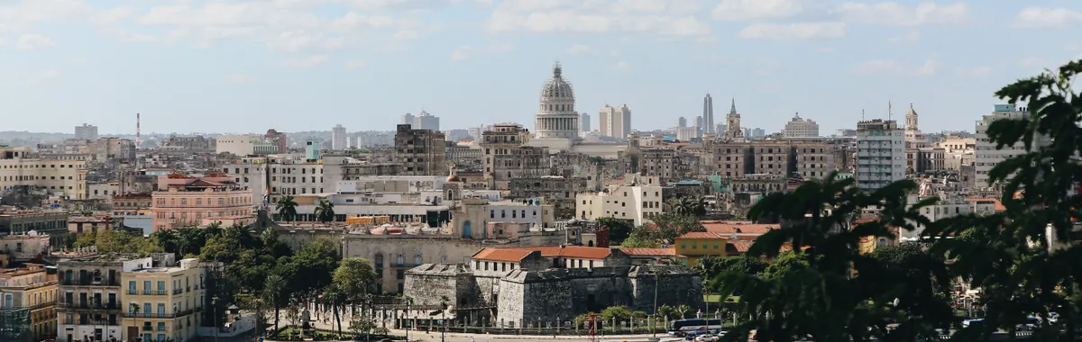 Beautiful cityscape view of Havana, Cuba with its iconic architecture and waterfront under a clear sky.