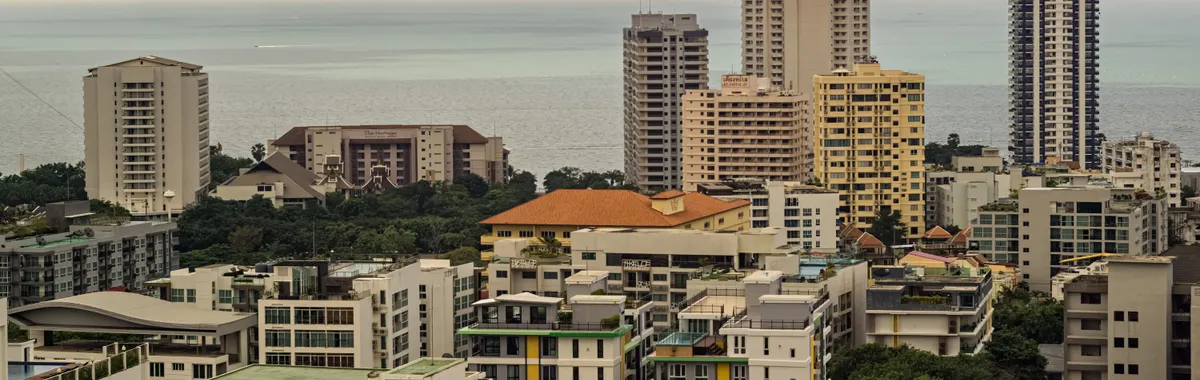High-rise buildings overlooking the ocean in Pattaya, Thailand, offering a panoramic view.
