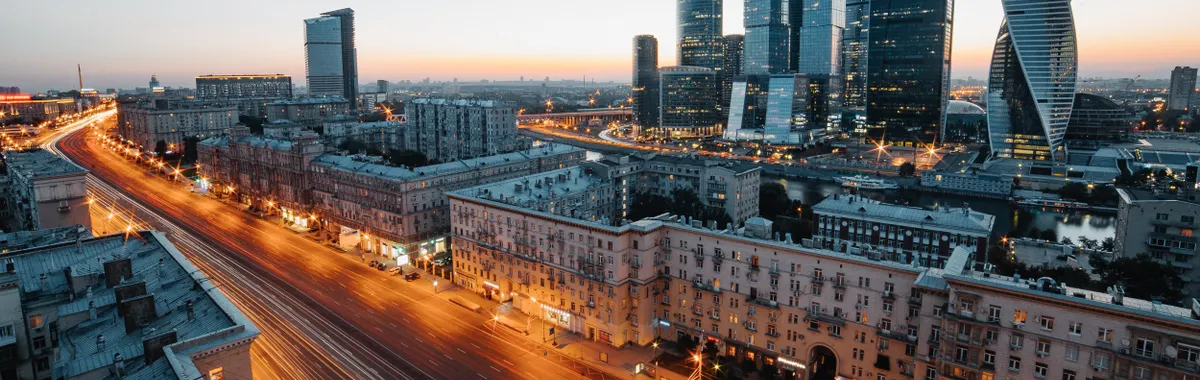 Aerial view of Moscow's skyscrapers and urban skyline during twilight, showcasing modern architecture.