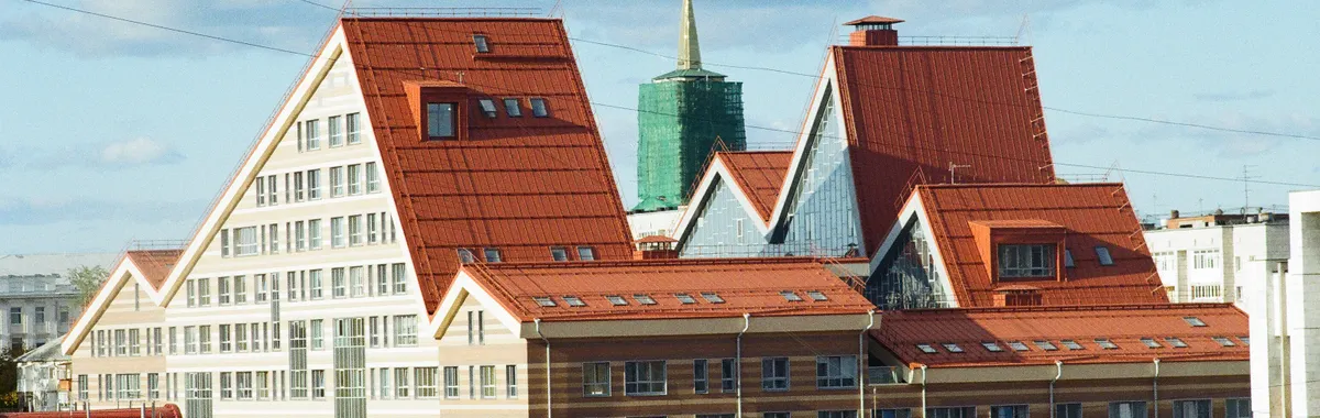 Explore the distinct architectural design of Perm's modern cityscape under a clear sky.