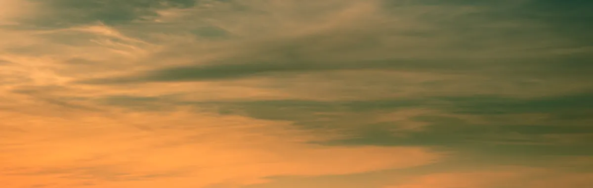 Stunning sunset view of Ciudad del Este skyline with dramatic clouds and vibrant colors.