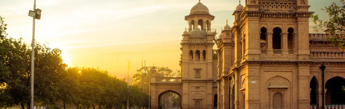 Beautiful view of Islamia College in Peshawar during sunset, showcasing historic architecture and a serene environment.
