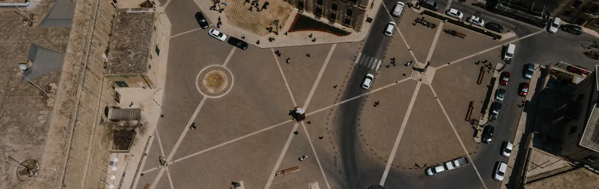 Drone shot capturing a historic city square in Valletta, Malta showcasing urban architecture.