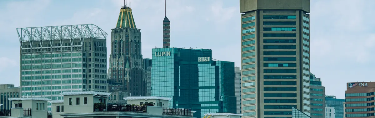 A vibrant view of Baltimore cityscape featuring iconic skyscrapers under a clear sky.